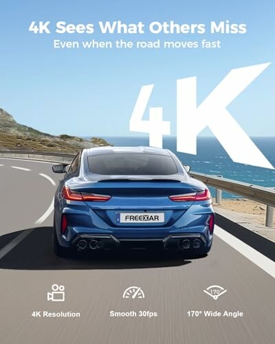 Blue car driving on a coastal road with 4K graphics and features displayed.