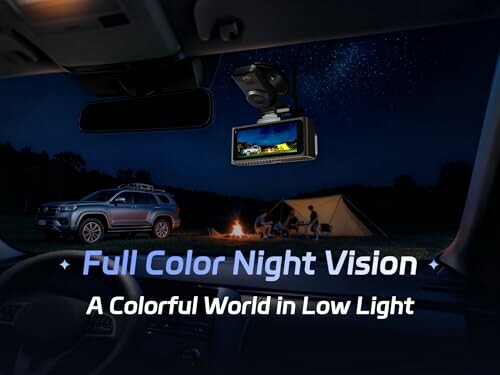 Car with full color night vision parked near a campfire and tent.