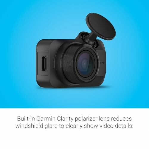 Garmin dash cam with built-in polarizer lens against blue background.